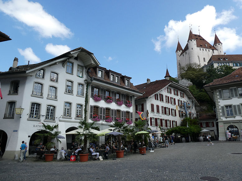 Rathausplatz with Burgerhaus, Zunfthaus zu Metzgern & the Castle above